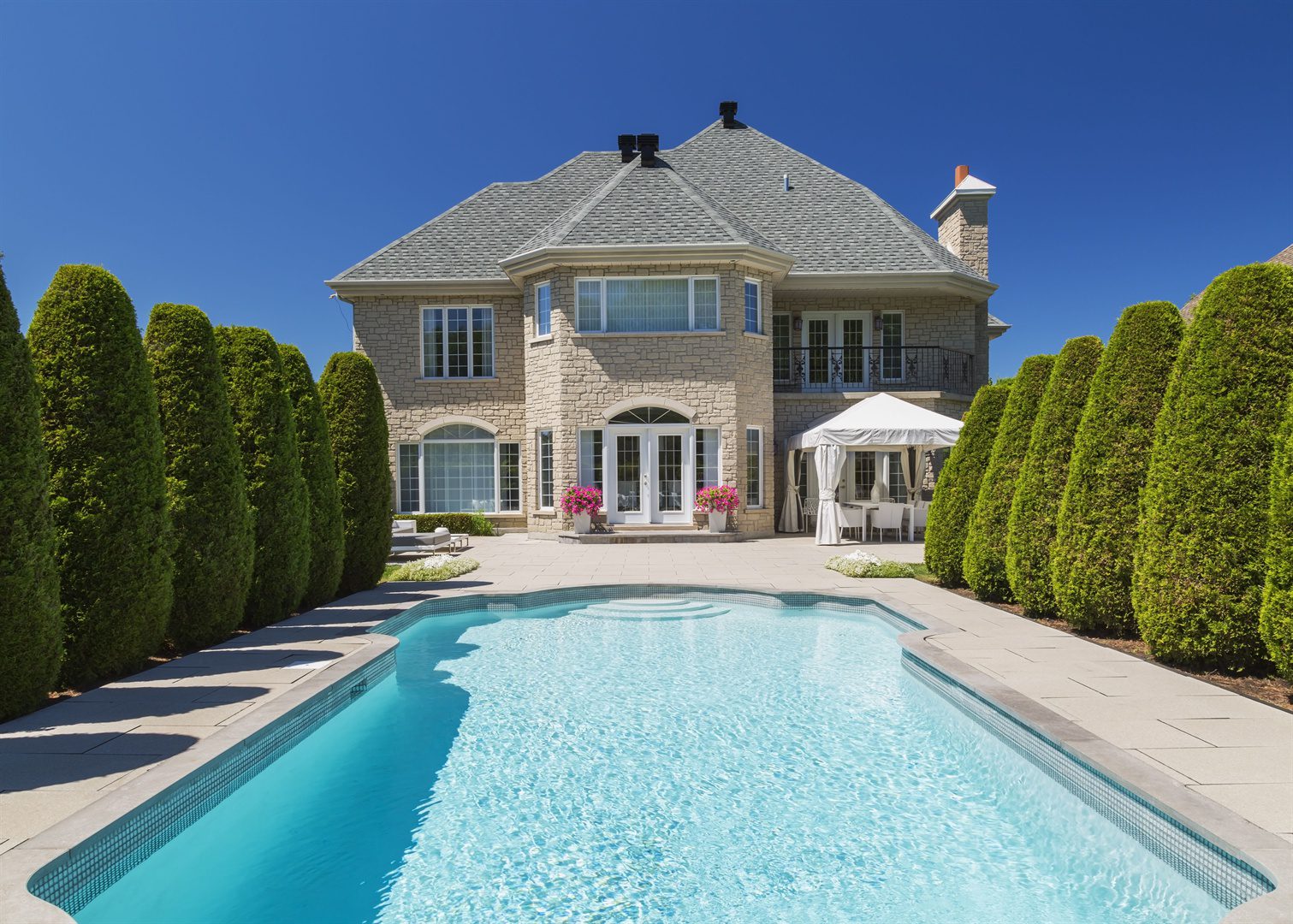 outdoor-swimming-pool-bordered-by-rows-of-cedar