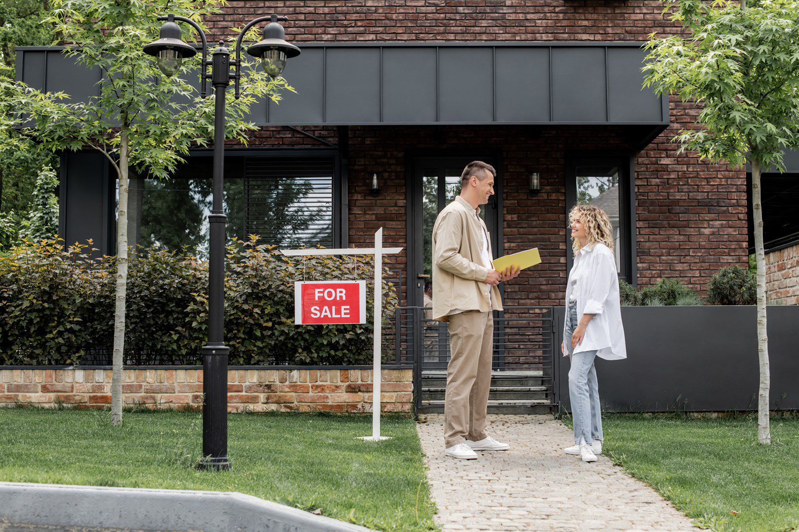 smiling-woman-talking-to-real-estate-agent