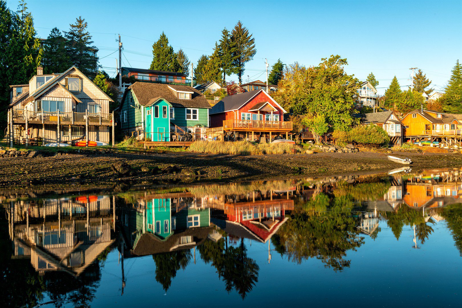 colorful-houses-near-a-lake-surrounded-by-greenery