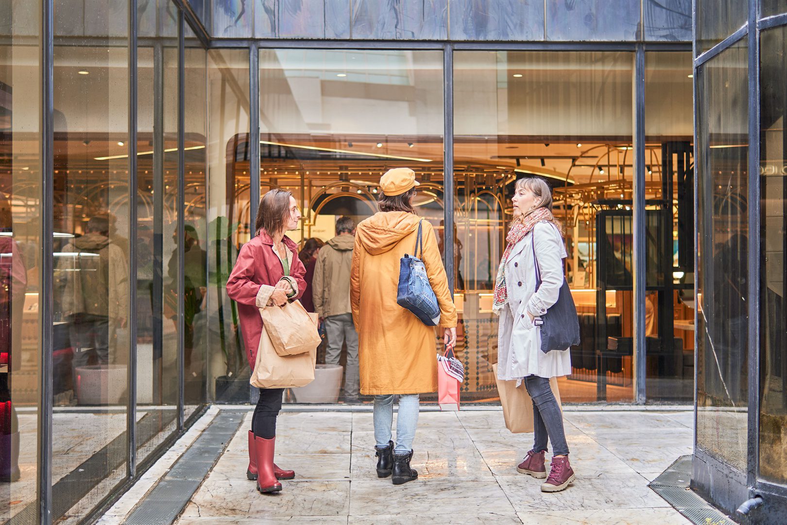 three-women-friends-with-shopping-bags