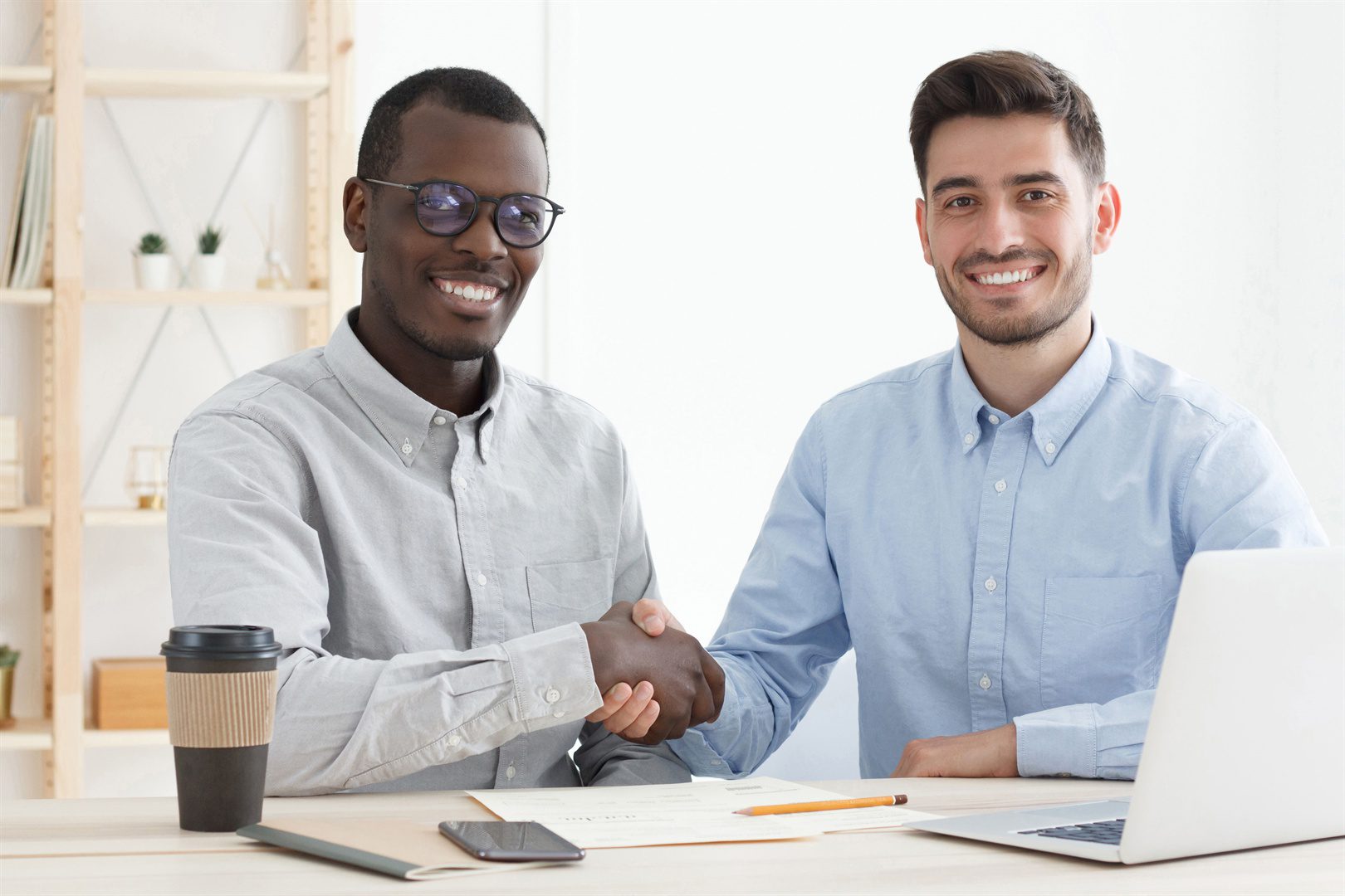 handshake-in-the-office-young-multiethnic-men