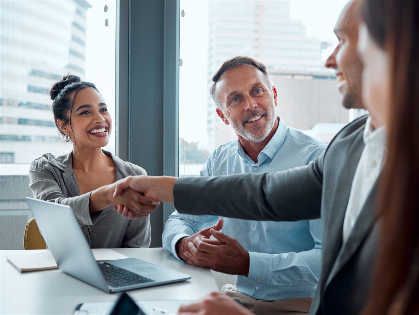 businesspeople-shaking-hands-during-a-meeting