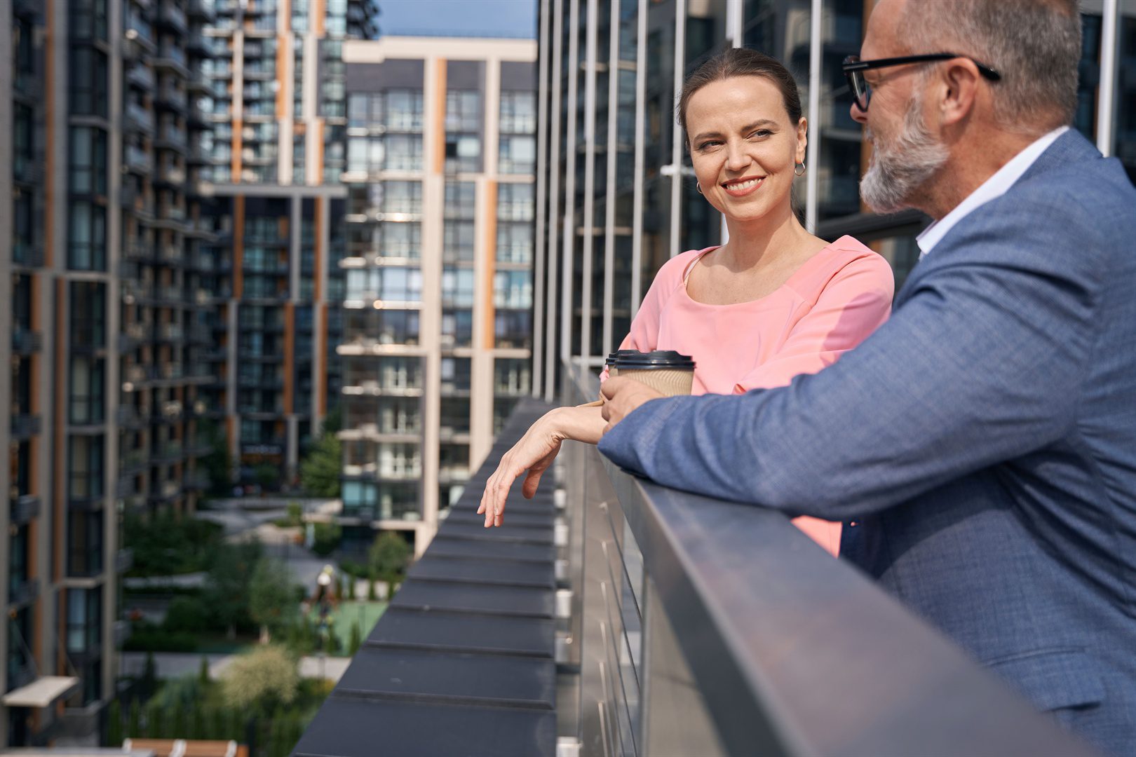 woman-with-a-smile-listens-to-man-in-gray-jacket